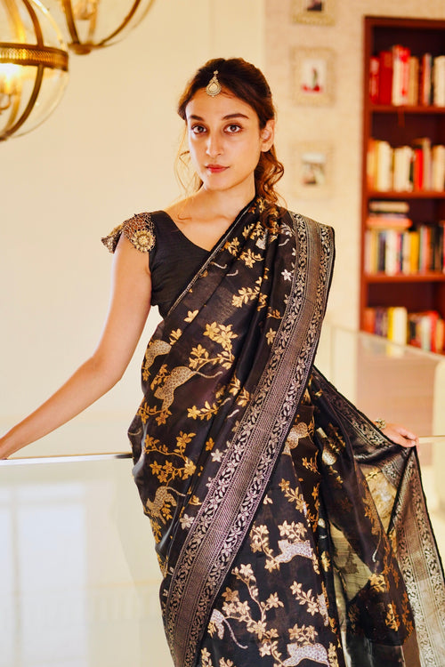 Black forest saree showing leopards on tree motif 