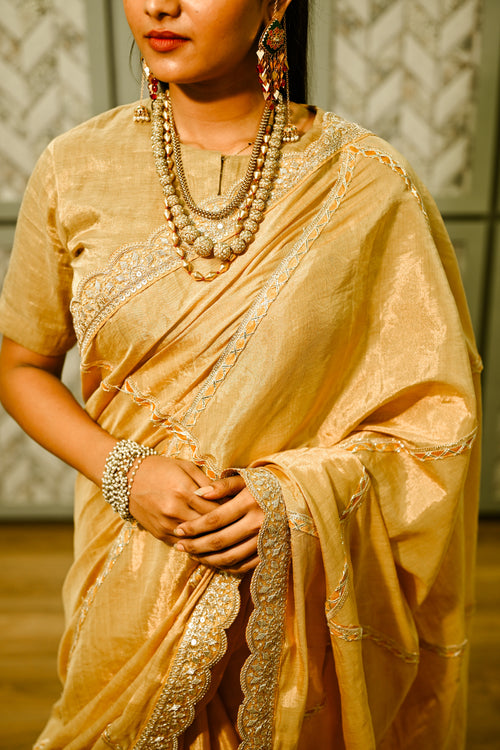 Gold silk tissue sari with gota patti