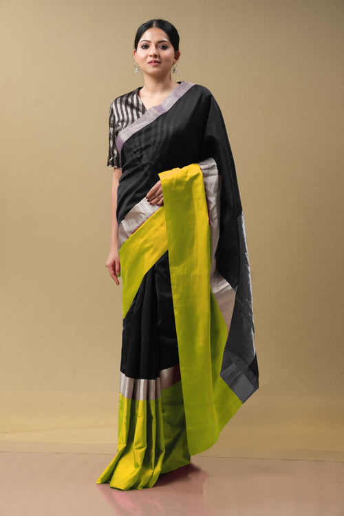 Black silk sari with broad green border (handwoven)