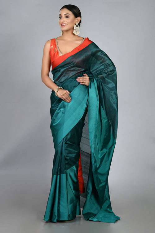 Teal silk sari with red blouse piece