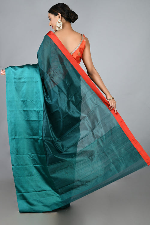 Teal silk sari with red blouse piece