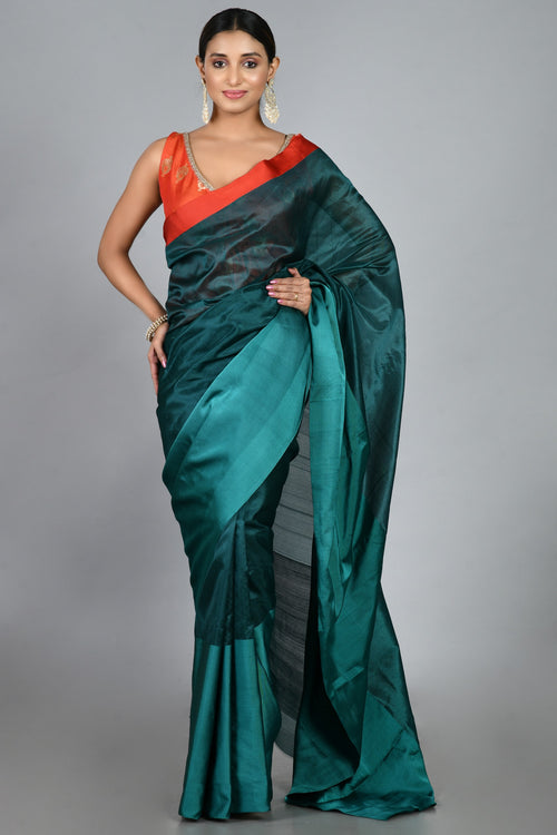 Teal silk sari with red blouse piece