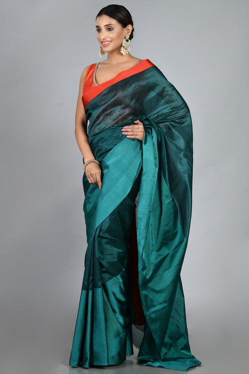 Teal silk sari with red blouse piece