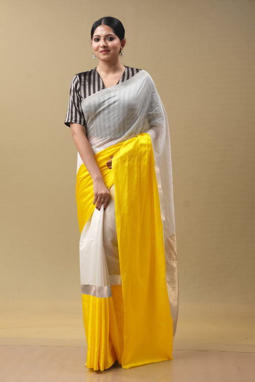 White sari with yellow mushru border