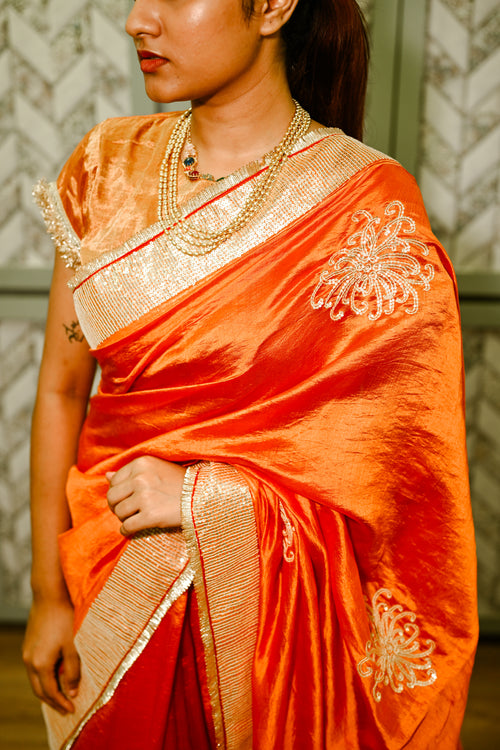 Orange silk handwoven sari with hand sequence work