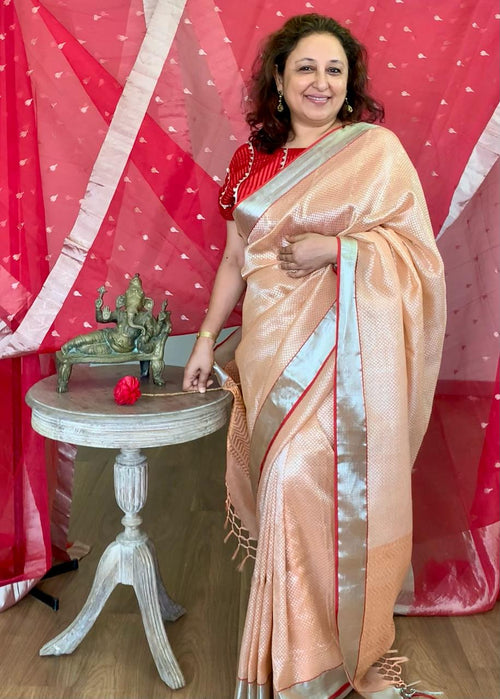Peach Real Zari Kota with intricate handcrafted details and a soft colour palette.