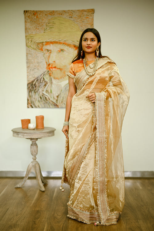Timeless Beige Gold Silk Tissue Sari With  Heavy Border