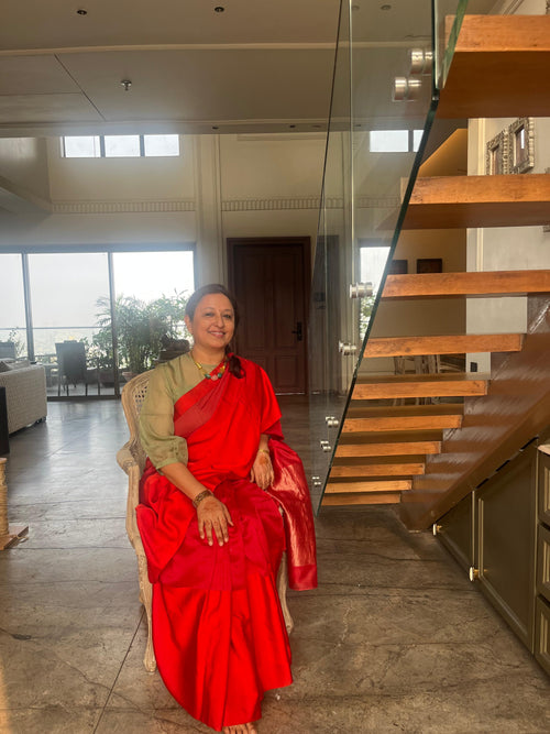 Red saree with red mushru silk border