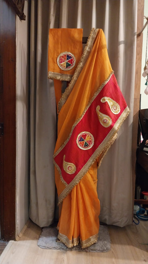 Truly festive saree in a beautiful tangerine color
