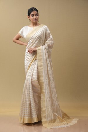 Stripe Silver Tissue Sari featuring a captivating interplay of metallic stripes, adding a touch of glamour and sophistication to this elegant traditional ensemble